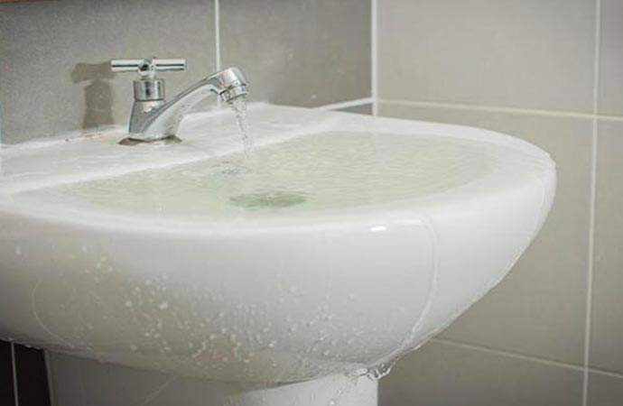 overflowing water from bathroom sink