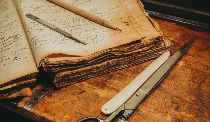 Professionally repaired documents alongside restoration instruments