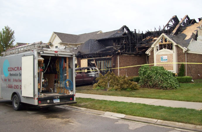 A fire damaged room needs repair.