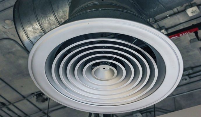 Clean ceiling air vent free of dust and debris