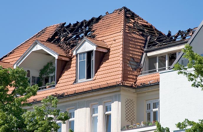 The aftermath of fire damage in a residential home undergoing restoration.