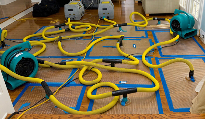 Water damage restoration service using equipment Water damage restoration service using equipment